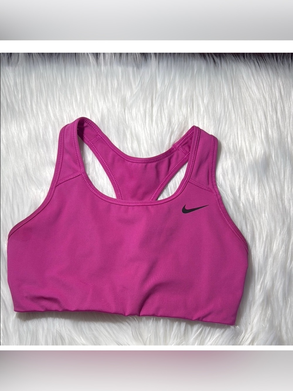 Nike Pink Sports Bra with Racerback Design and Moisture-Wicking Fabric